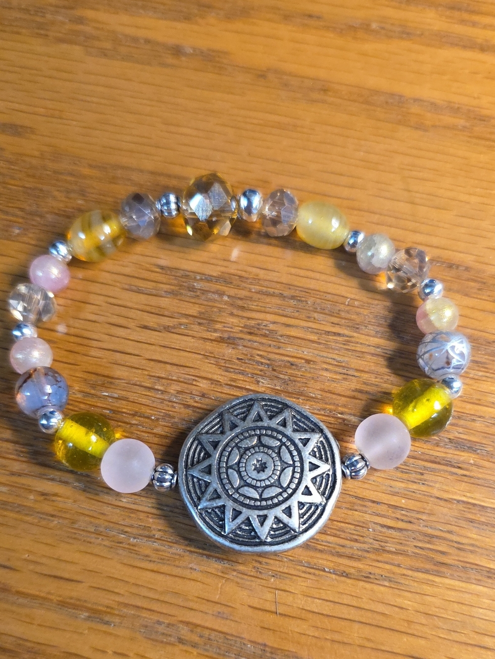 Yellow and Pink Beaded Bracelet with Decorative Silver Medallion